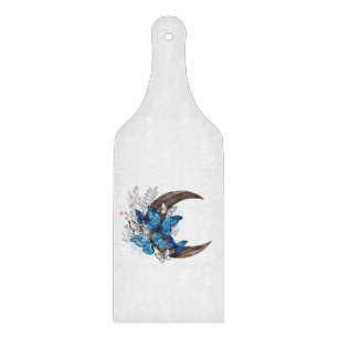 Blue butterflies on wooden crescent cutting board