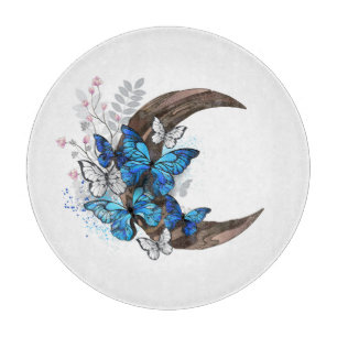 Blue butterflies on wooden crescent cutting board