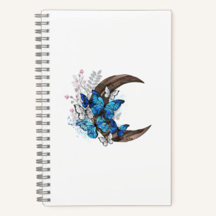 Blue butterflies on wooden crescent notebook