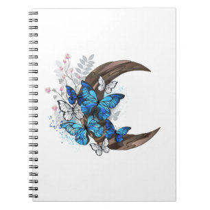 Blue butterflies on wooden crescent notebook