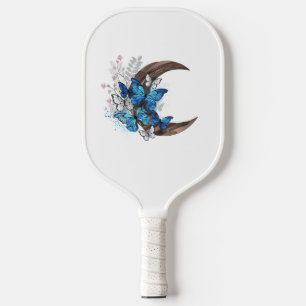 Blue butterflies on wooden crescent pickleball paddle