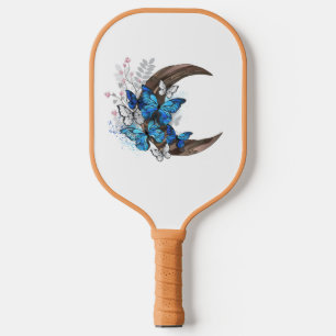 Blue butterflies on wooden crescent pickleball paddle