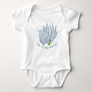 Blue Chalk Sticks on a Baby Bodysuit