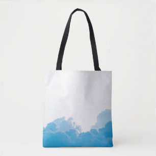 BLUE CLOUDS UNDER WHITE SKY TOTE BAG