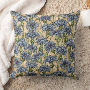 Blue cornflowers, wild flowers on honney yellow cushion