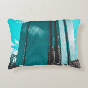 BLUE CURTAIN WALL BUILDING UNDER TEAL SKIES DECORATIVE CUSHION