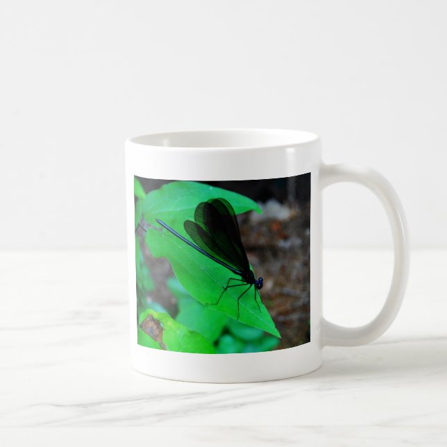 Blue Damselfly on a green leaf. Coffee Mug (Right)