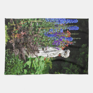 Blue delphinium flower garden and statue tea towel