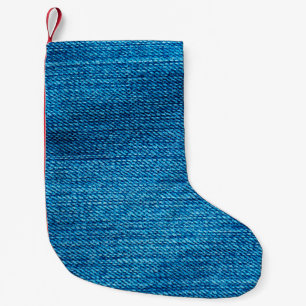 blue denim background used as a backdrop small christmas stocking