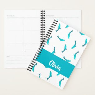Blue dolphins on white planner