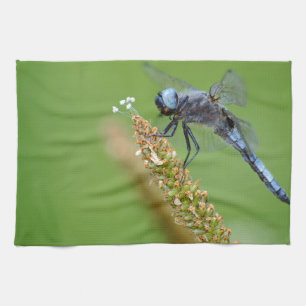 Blue dragonfly on grass tea towel