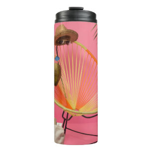Blue flip-flop beside chair thermal tumbler
