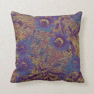 Blue flowers against leaf camouflage pattern cushion
