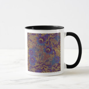 Blue flowers against leaf camouflage pattern mug