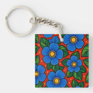 Blue Flowers and Green Leaves on a Red Background Key Ring