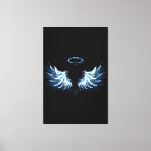 Blue Glowing Angel Wings on black background Canvas Print