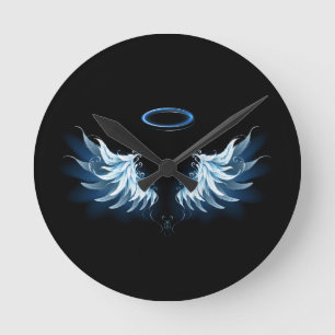 Blue Glowing Angel Wings on black background Round Clock