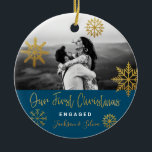 Blue Gold Snowflakes First Christmas Engaged Ceramic Ornament<br><div class="desc">Bright Christmas holiday photo ornament with gold snowflakes and navy blue background for engaged couple. Personalise it by adding your names. It's a good gift for newly weds or for a fiance/fiiancee.</div>