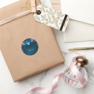 Blue gothic heart surrounded by magical flowers classic round sticker