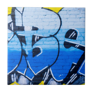 Blue graffiti on a brick wall ceramic tile