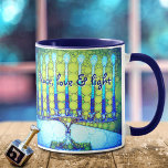 Blue Green Hanukkah Menorah Peace Love Light Quote Mug<br><div class="desc">“Peace, love & light.” A close-up photo illustration of a bright, colorful, blue and green artsy menorah helps you usher in the holiday of Hanukkah in style. Feel the warmth and joy of the holiday season whenever you drink out of this stunning, colorful Hanukkah coffee mug. Makes a striking set...</div>