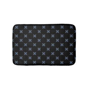 Blue-grey cross stitches on black bath mat