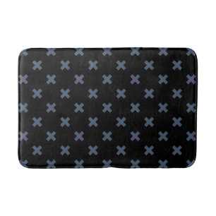 Blue-grey cross stitches on black bath mat