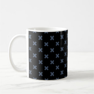 Blue-grey cross stitches on black coffee mug