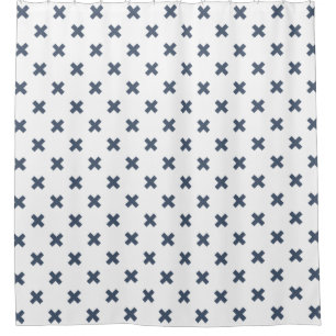 Blue-grey cross stitches on white shower curtain