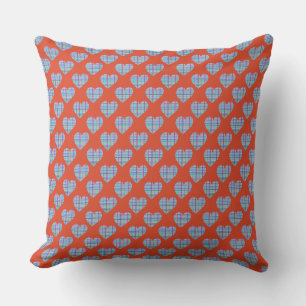 Blue hearts on red cushion