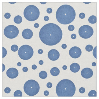 Blue knitted circles on a white background fabric