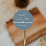 Blue | Modern Bow Simple Minimal Christmas Classic Round Sticker<br><div class="desc">Finish your holiday mailings and gifts with these sweet and simple Christmas stickers,  customisable with your preferred holiday greeting and family signature (shown with "Merry Christmas") on a soft blue background. A petite bow running through the centre completes this elegant minimalist holiday design.</div>