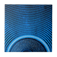 Blue music speaker and sound waves