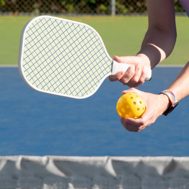 Blue net mesh on white pickleball paddle (Insitu)