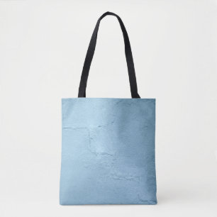Blue painted concrete wall during daytime tote bag