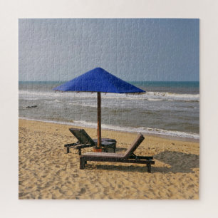 Blue parasol by the sea in the sand, waves, ocean jigsaw puzzle