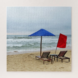 Blue parasol by the sea in the sand, waves, ocean jigsaw puzzle