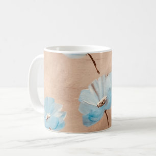 Blue poppies in grass coffee mug