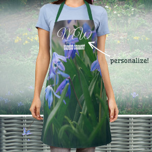 Blue scilla flowers in the spring garden apron