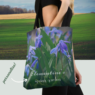 Blue scilla flowers in the spring garden tote bag
