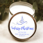 Blue Silver Ribbon Tree Merry Christmas Script Classic Round Sticker<br><div class="desc">This modern holiday sticker features a blue and silver faux foil ribbon Christmas tree sprinkled with silver faux glitter,  and the words "Merry Christmas" in stylish blue calligraphy script. Personalise it with your family's name in serif font.</div>