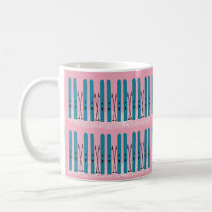 Blue skis on snow with pink  coffee mug