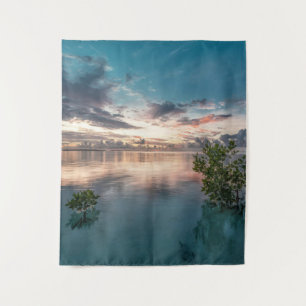 blue sky with red and dark clouds reflected on sea tapestry