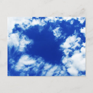 Blue spring sky dotted with many bizarre clouds postcard