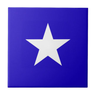 Blue star on white background ceramic tile