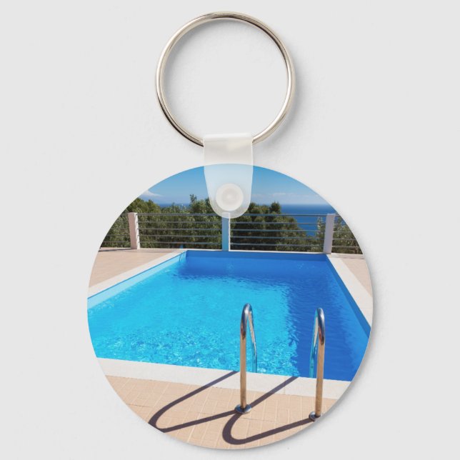 Blue swimming pool with steps at sea key ring (Front)