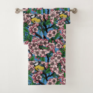 Blue tit birds in the blooming cherry tree on blue bath towel set
