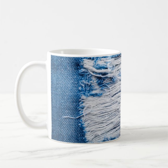 Blue torn denim jeans texture with space for text coffee mug (Left)