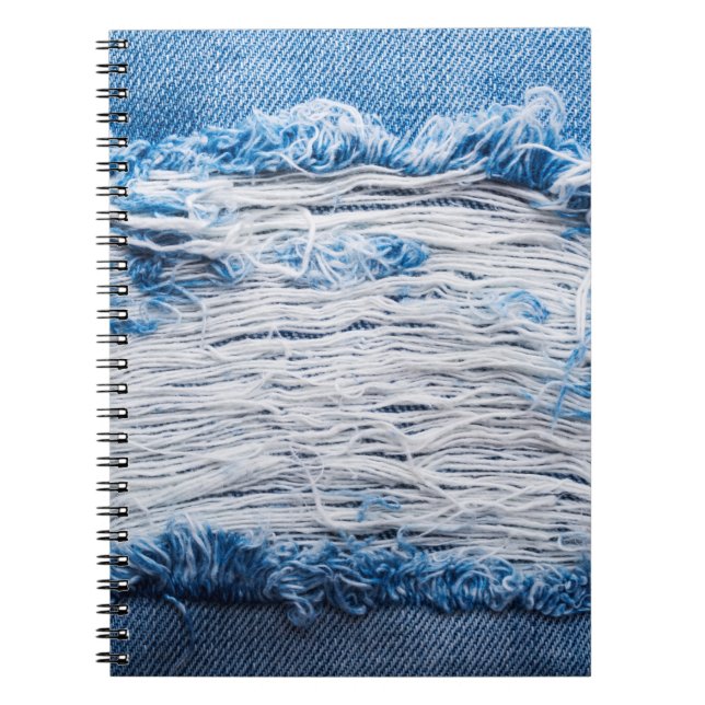 Blue torn denim jeans texture with space for text notebook (Front)