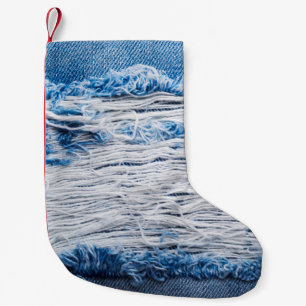 Blue torn denim jeans texture with space for text small christmas stocking